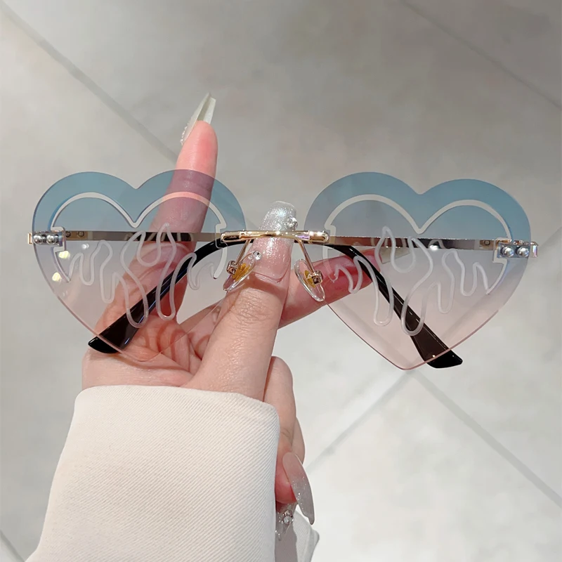 KAMMPT Randlose herzförmige Sonnenbrille, modisch, niedlich, ausgehöhlt, Dekor, Rave-Sonnenbrille, Damen, trendiges Markendesign, Urlaubs-Sonnenbrille