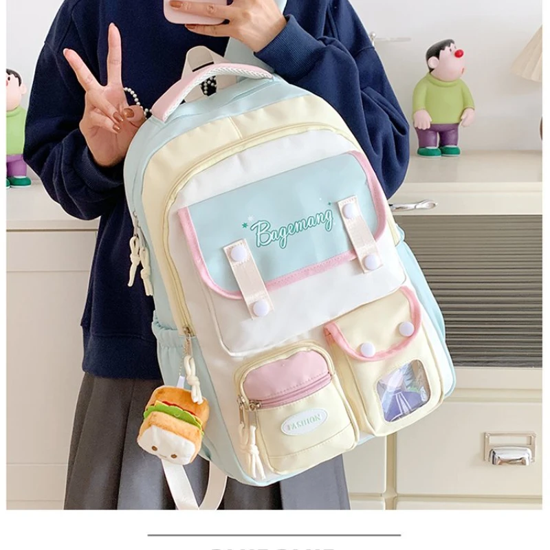 かわいいパステルカラーのバックパック、ピン用クリアウィンドウ付き、アニメスタイルのスクールトラベルデイパック、女の子向けキュートな多ポケットリュックサック