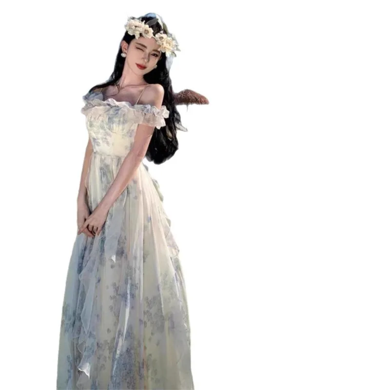 Off-the-shoulder beach dress with a French ruffle hem, a flowing fairy-style dress with a seaside holiday vibe.