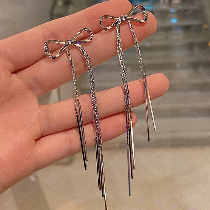 

2024 New Metal Glossy Bow Long Tassel Stud Earrings for Women Fashion Trend Simple Personality Girls Party Jewelry Birthday Gift