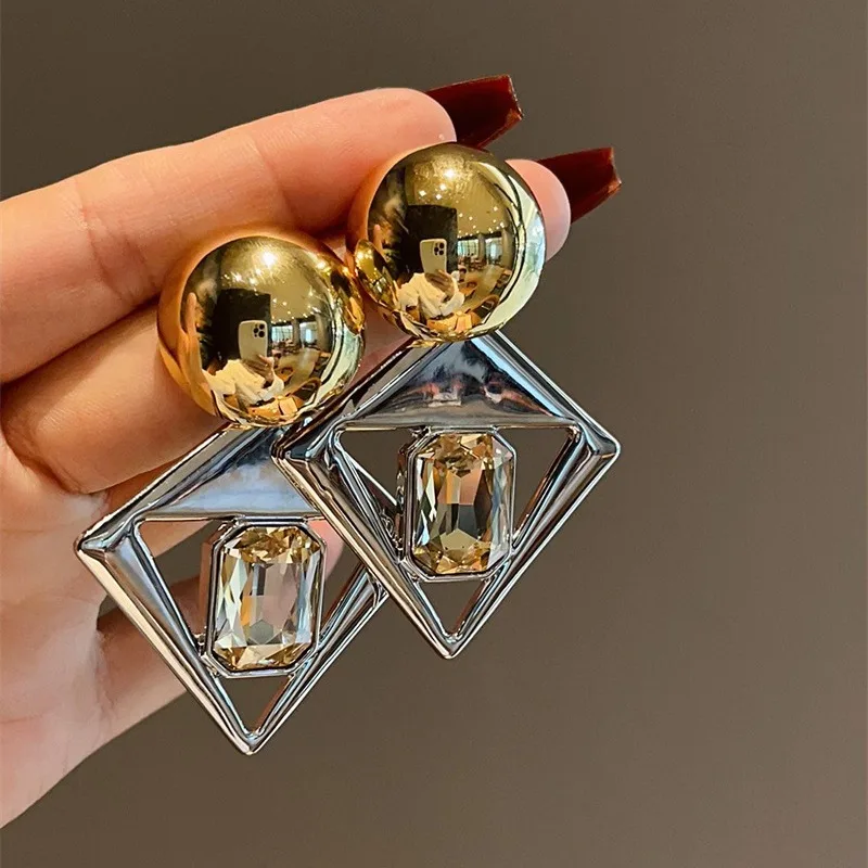 

Electroplated 18K gold exaggerated large earrings with geometric gemstone inlay and hollow design for ladies