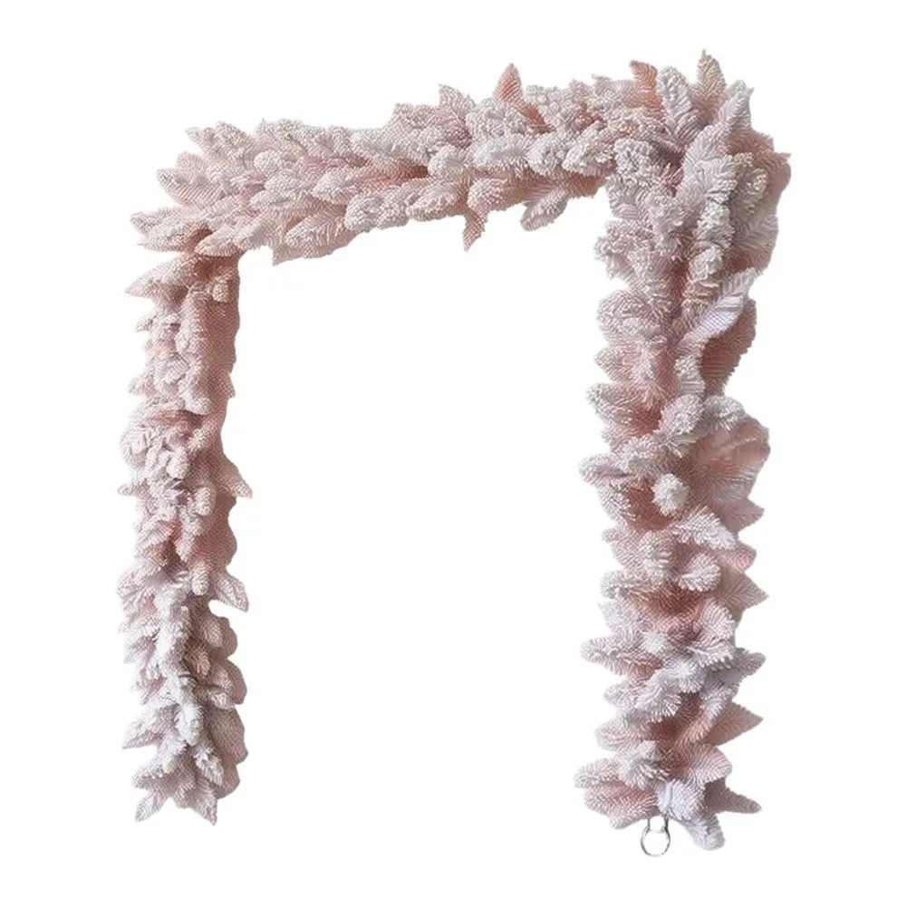 Artificial pink pine garland with soft flocked snow layer for Christmas front door mantel and romantic event styling