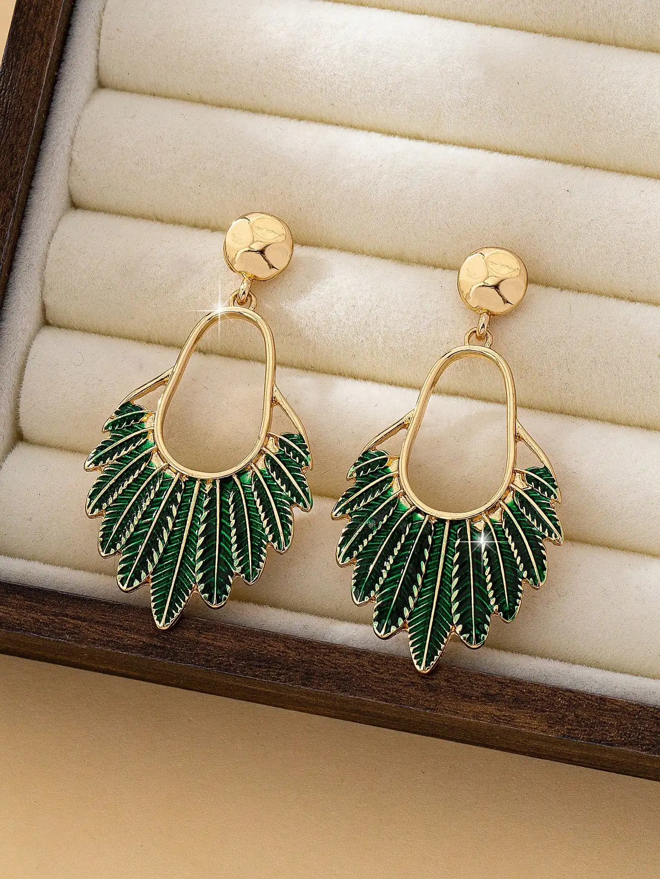 A Pair of Trendy and Fashionable Oil-Drip Leaf Earrings for Women, Featuring a Unique and Elegant Design That Is Versatile