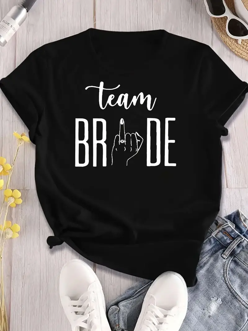 Playful Black Team Bride T-Shirt With Bold Cursive Team Above Bride And Middle Finger Gesture For A Fun Bachelorette Party Gift