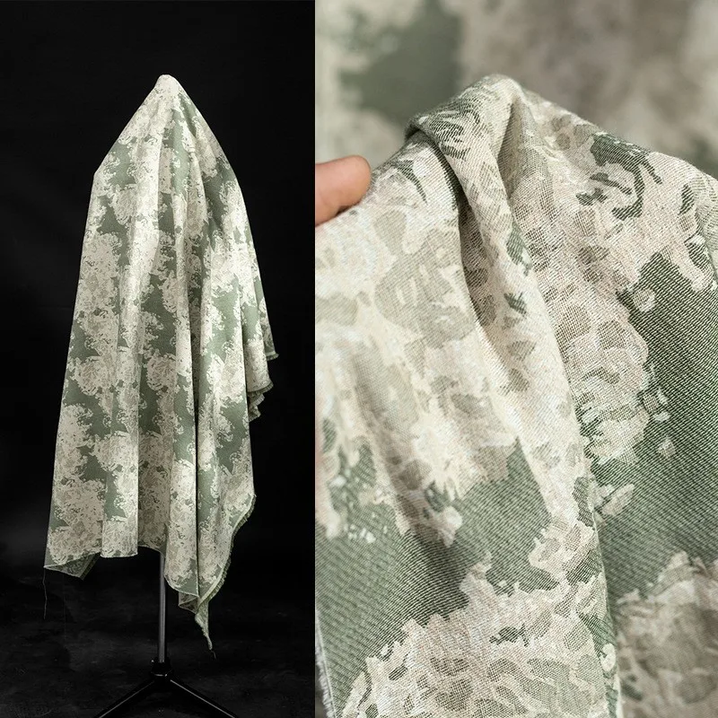 

Dark-patterned white and green scarred cotton linen jacquard fabric with a washed for suit designed by fashion designer