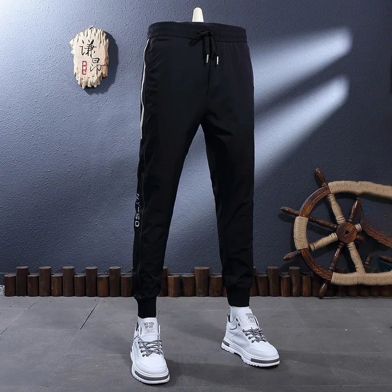 

Summer thin, cool and breathable black striped elastic waistband, slim fit, small foot binding, casual men's sports pants