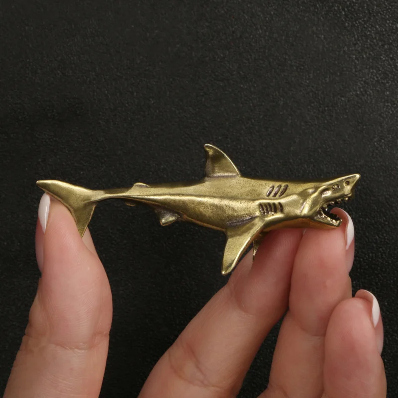 

Bronze solid small figurine model of a shark for tabletop decoration and as a small handicraft.