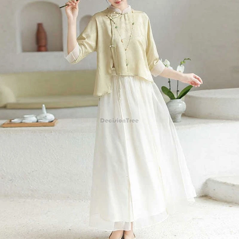 

Лето 2025 года, новый улучшенный комплект Тан в китайском стиле, свободный воротник-стойка, блузка Cheongsam с половиной рукава, длинная полуюбка, комплект из 2 предметов