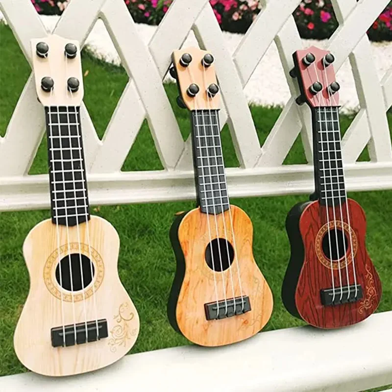 Mini Guitarra Clásica de 4 cuerdas para niños, instrumento de juguete para principiantes, simulación de juego, Enseñanza Temprana, guitarra pequeña