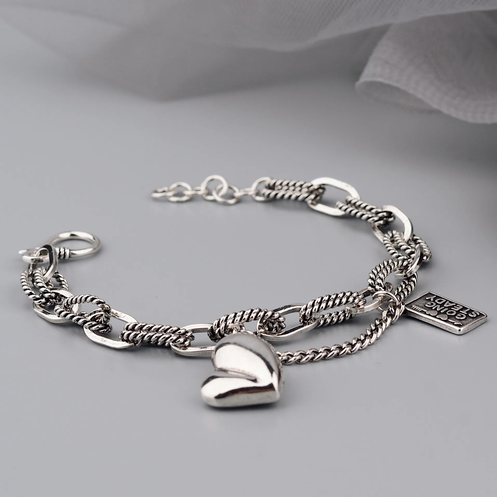 QMCOCO Silver Color Design Asymmetric Heart-Shape Pendant Square Letter Bracelet Woman Fashion Personality Jewelry Accessories