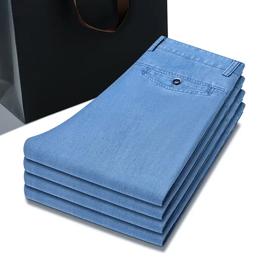 Imagen 1 del producto 2025 Primavera Verano nuevos pantalones vaqueros sueltos finos de color azul claro para hombres moda de negocios pantalones vaqueros elásticos de tela Lyocell pantalones de marca masculina