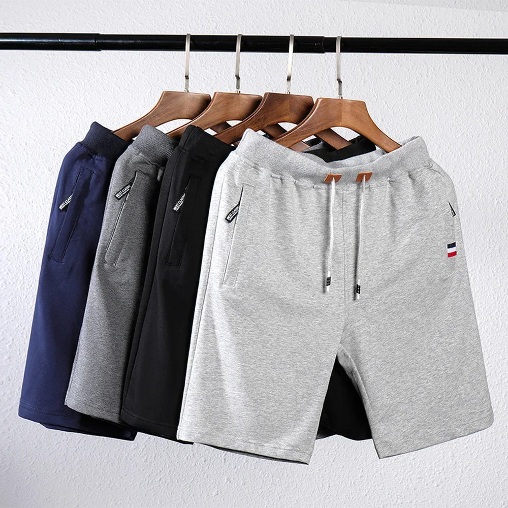 Pantalones cortos de chándal para hombre, Bermudas de cintura elástica, talla grande, para entrenamiento, informales, Color sólido, con bolsillos y cremallera, verano, 2022