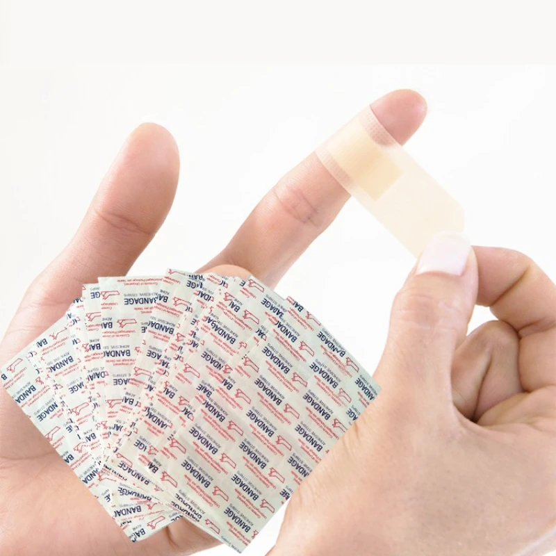 50/100/200 قطعة تنفس الفرقة المعونة ضمادة مضادة للماء الإسعافات الأولية الجرح خلع الملابس الشريط الطبي الجرح الجص مجموعات الطوارئ الضمادات