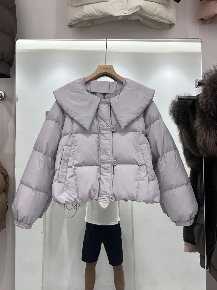 سترة ذات ياقة دمية بلون سادة للنساء 2025 النسخة الكورية الجديدة سترة قصيرة غير رسمية بتصميم بطة بيضاء عصرية