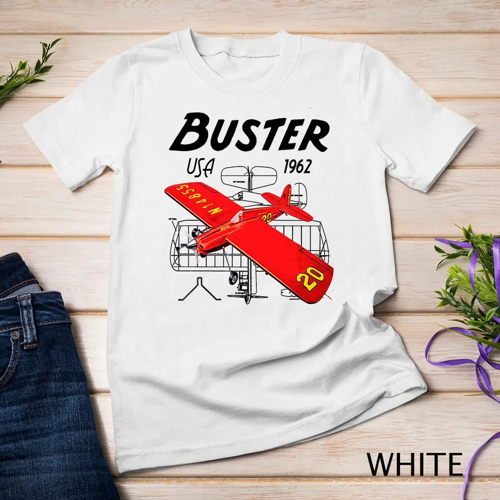 May include White t shirt with a red and yellow airplane graphic the text Buster USA 1962 printed on front vintage Washed