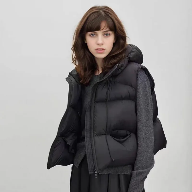 เสื้อกั๊กขนเป็ดแบบมีฮู้ดสำหรับฤดูใบไม้ร่วงและฤดูหนาว ทรงหลวม หนานุ่ม อุ่นสบาย เหมาะสำหรับผู้หญิง สีขาว ซิปหน้า ไม่มีแขน