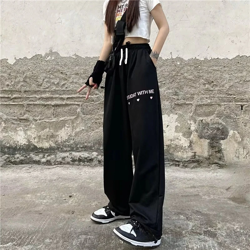 2026 Trendy Women Y2K Hip Hop Black Slogan Print Quick Dry Baggy Pants Elastic Waist Comfy Streetwear Trousers for Daily Wear