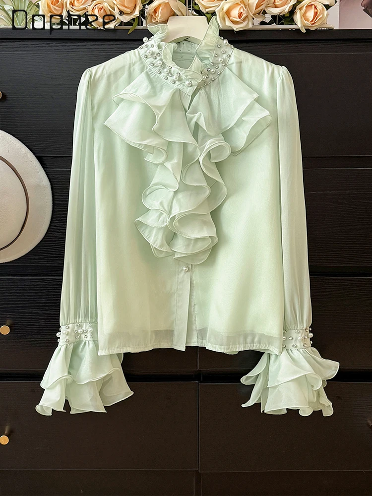 Camisa de manga acampanada con cuello levantado y perlas de gama alta de estilo francés para mujer otoño 2025 Top elegante de moda con una sola botonadura