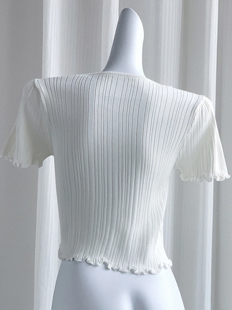 Blusa fena de verão, manga curta, renda vazada, laço borboleta, emenda de malha,  crimento, design moderno e elega...