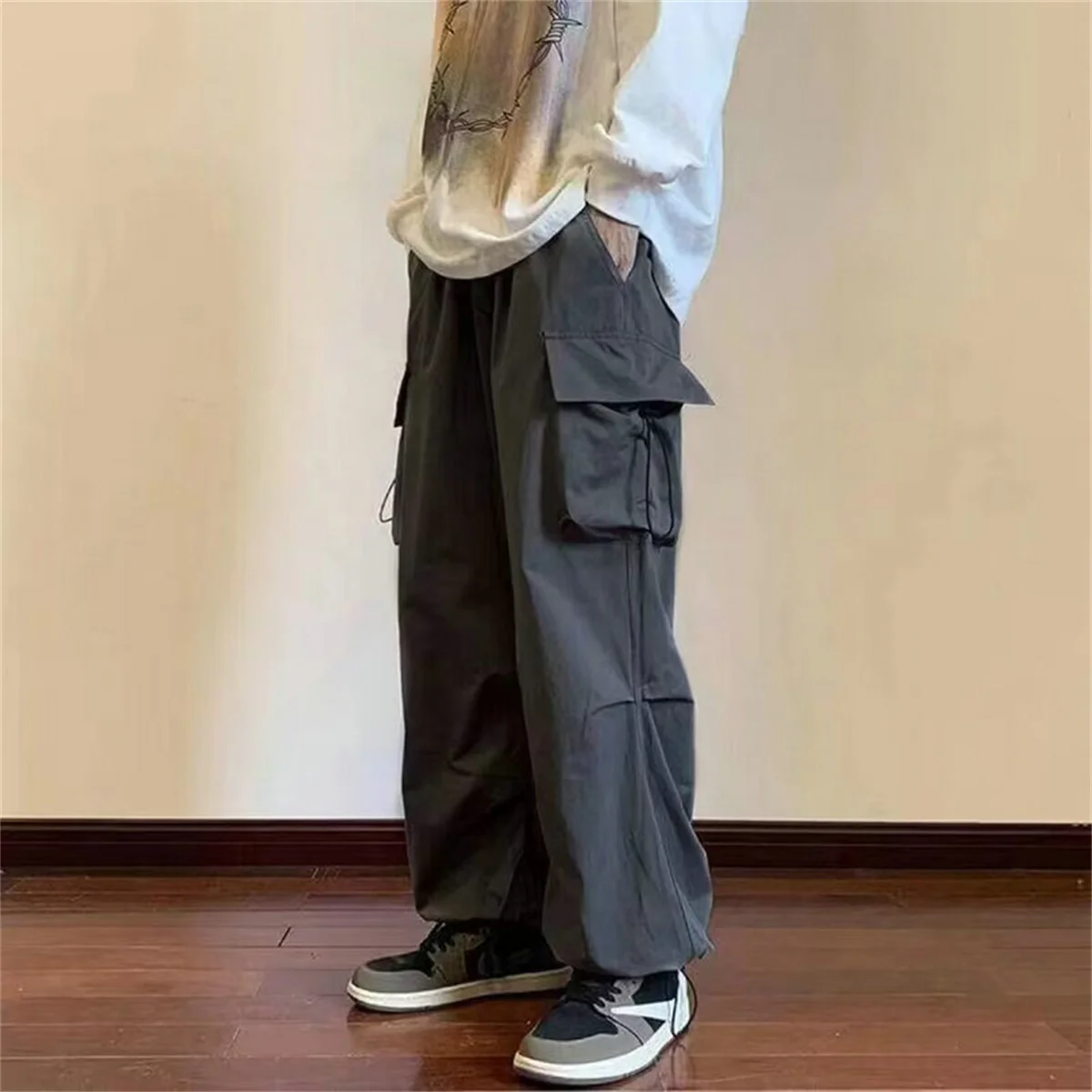 

Streetwear 2025 New Spring Harem Multicolored Casual Pants Men Elastic Waist Solid Color Cargo Pants Multi Pocket Baggy Pants