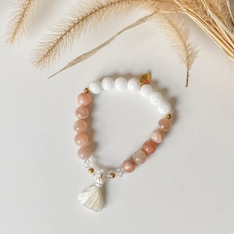 ZOEY stone bracelet made with natural White Jade and Sunstones, Stellaris crystal beads, off white tassel and gold stainless