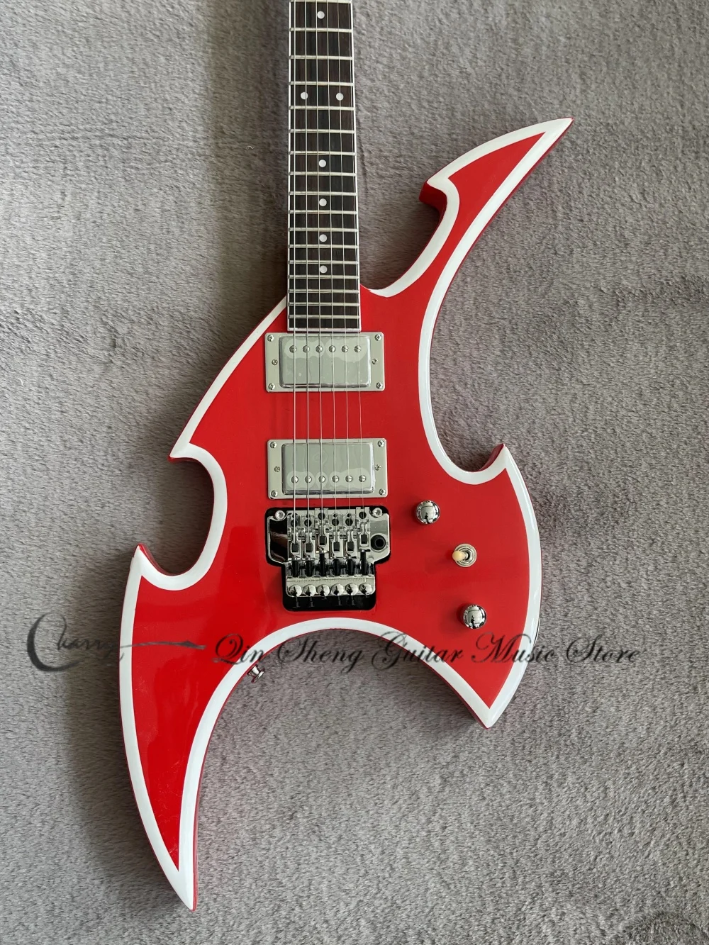 Red electric guitar, white edges, irregular guitar, Tremolo bridge, sealed pickups, solid wood body, rosewood fretboard