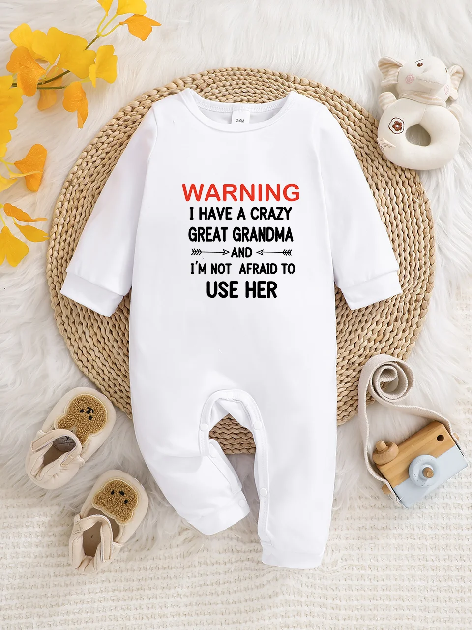 A baby long-sleeved onesie with interesting letter prints. It features a buttoned design for easy putting on and taking off