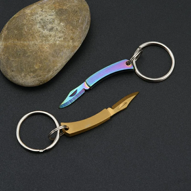 Stainless steel unpacking package, color titanium small blade, convenient to carry folding small blade keychain pendant