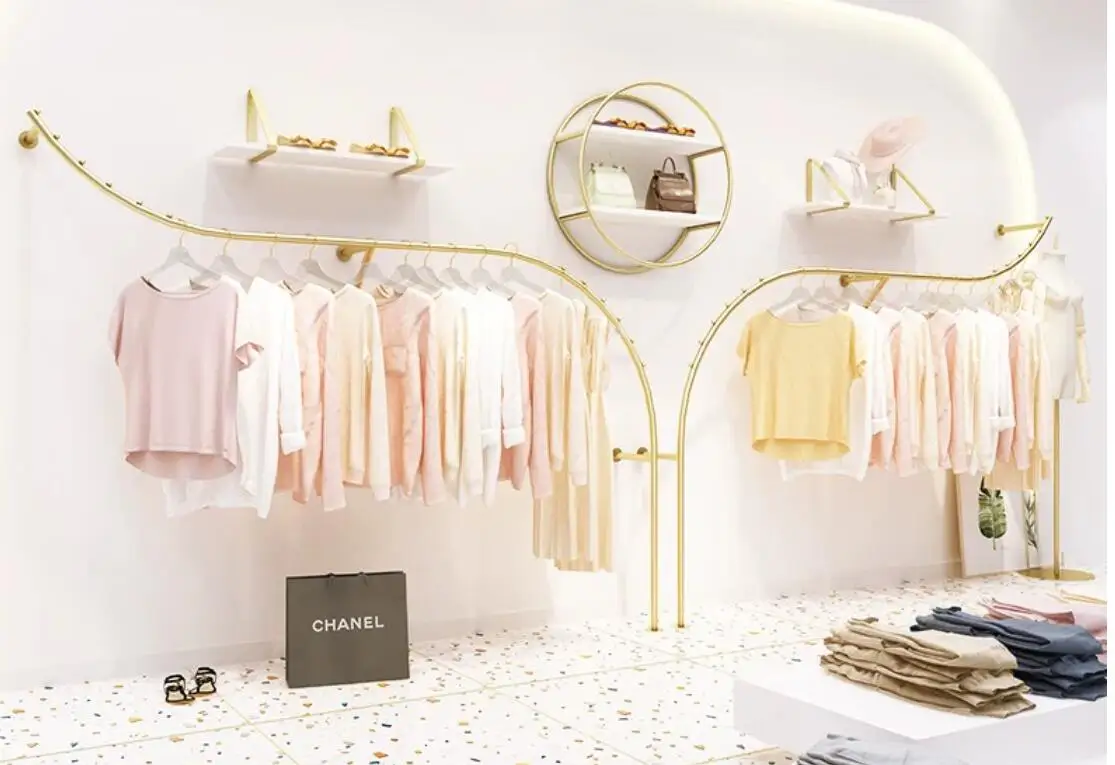Wall mounted display racks in clothing stores; Wall mounted hangers in women's clothing stores; display rack