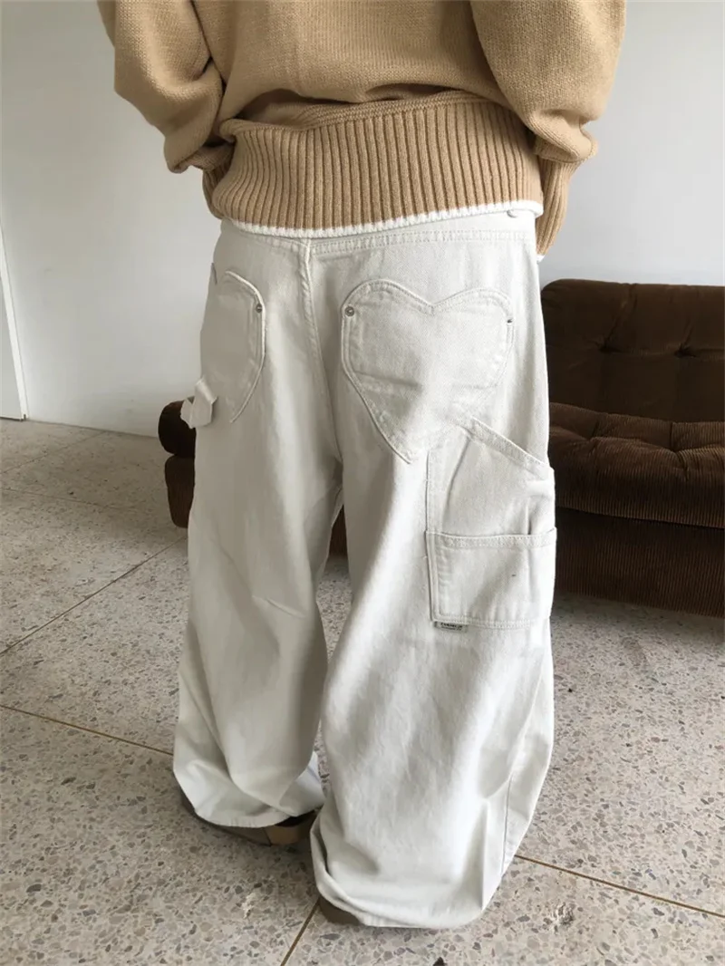 بنطلون جينز نسائي بتصميم حصري للعمل بخصر عالٍ وساق واسعة مع جيب على شكل قلب وقصة فضفاضة للخريف 2025 #1