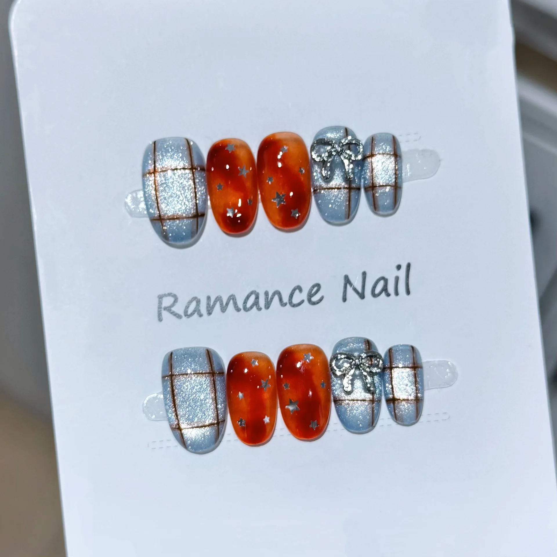 

10pcs Sweet & Edgy Orange-Blue Handmade Nails Checkered Bow Star Rhinestone Press on Nail Short Oval Fake Nail for Women&Girl