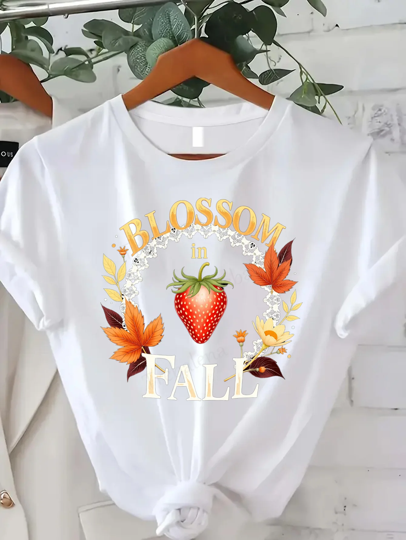 

Comfortable Women's Print T-shirt "Blossom in Fall T-Shirt - Autumn Leaves & Strawberry Design"