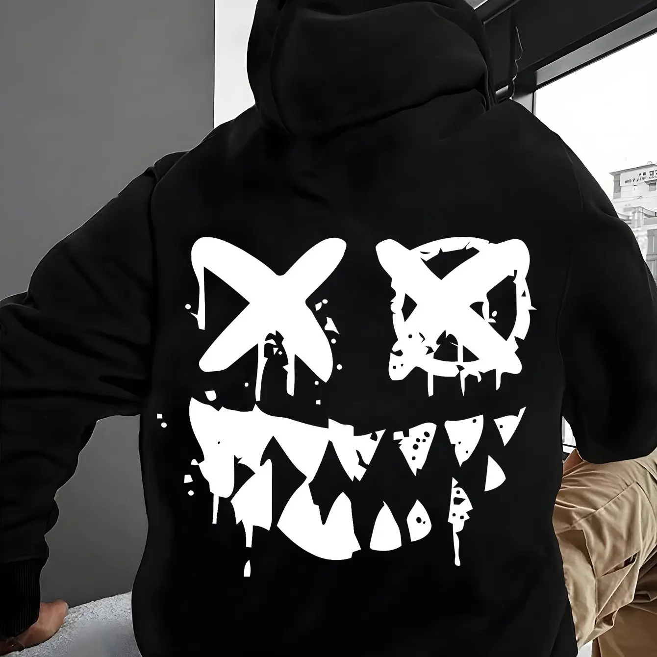 

​​unisex black hoodie urban art print xo yx oy text 2025 oversized streetwear creepy x eyes smile with teeth drip paint effect