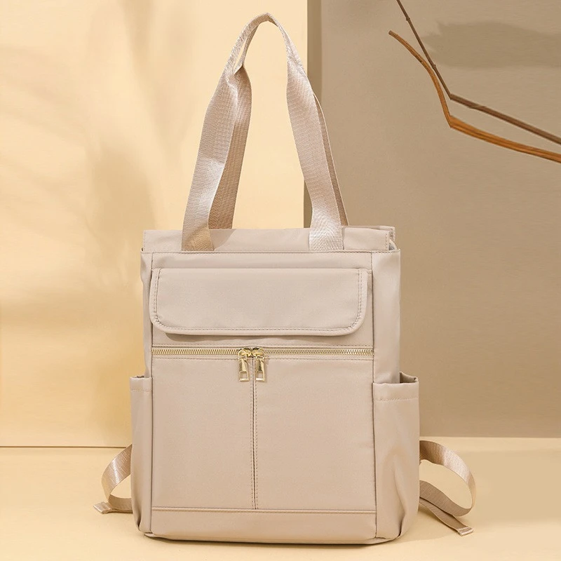 Europe and the United States new shoulder bag women's contrasting outdoor travel backpack Oxford portable leisure shoulder bag.