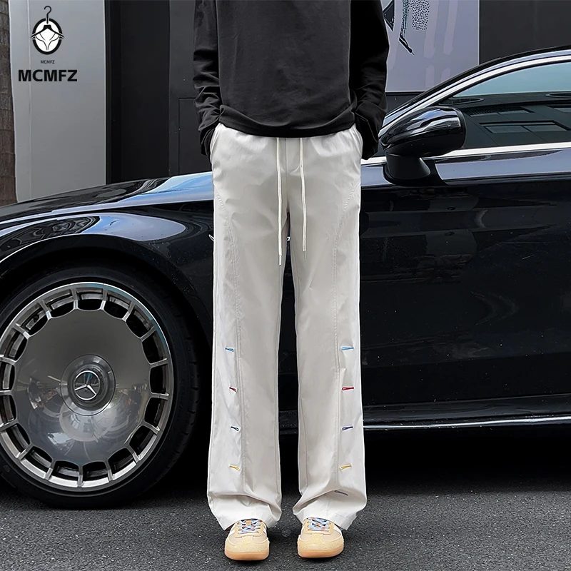 Elastic Waist Drawstring Casual Pants For Men Loose Wide Leg Cut Side Stitch Details Smooth Light Fabric For Weekend Walk