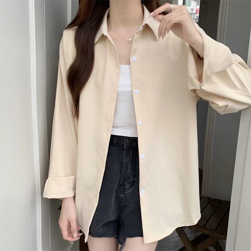 Nueva camisa holgada blanca de manga larga para mujer, estilo francés, Simple, Color sólido, Tops informales de un solo pecho, abrigo fino para primavera y verano