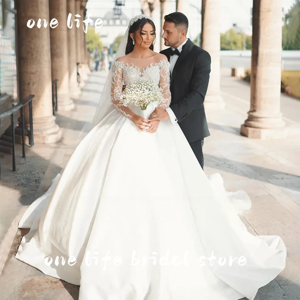 ชุดแต่งงานแบบบอลกาวน์ประดับลูกปัดหรูหราสไตล์ดูไบจาก Onelife รุ่นปรับแต่งได้ ปี 2025 คอซีทรูแบบเจ้าหญิง สำหรับเจ้าสาว ชุดเจ้าสาว Vestido De Novia