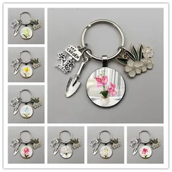 Fashion keychain popular indoor orchid and grass charm, orchid flower shovel keychain, men and women gift jewelry keychain.