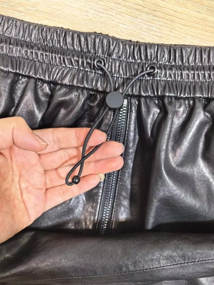 Damen Büro-Mode Elastische Taille Einfarbiger Reißverschluss-Taschen Echtleder-Rock Loser Schafsleder Knielanger Handgefertigter Rock