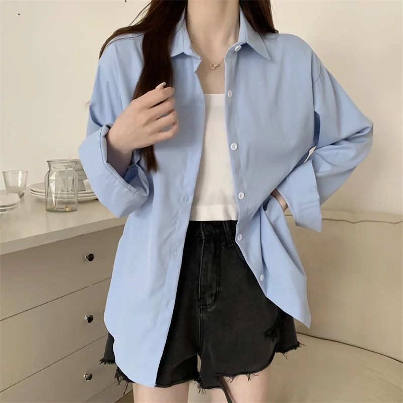 Nueva camisa holgada blanca de manga larga para mujer, estilo francés, Simple, Color sólido, Tops informales de un solo pecho, abrigo fino para primavera y verano