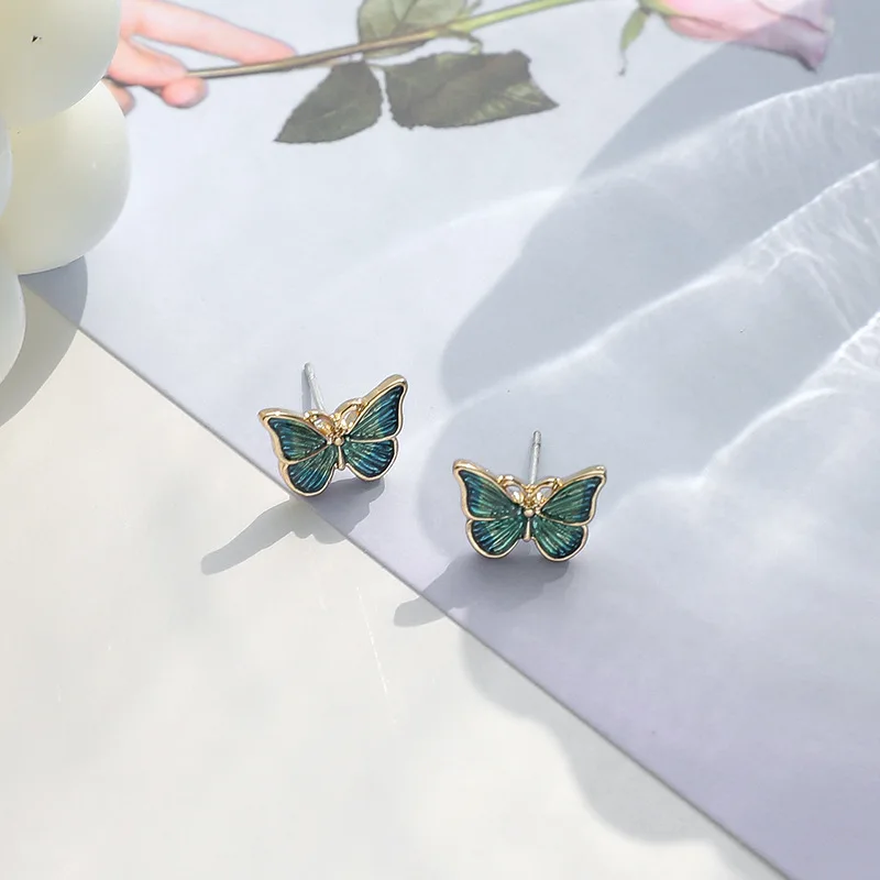 Los fabricantes de pendientes coreanos venden pendientes de mariposa de estilo de pintura al óleo suaves y flexibles, nuevos pendientes versátiles