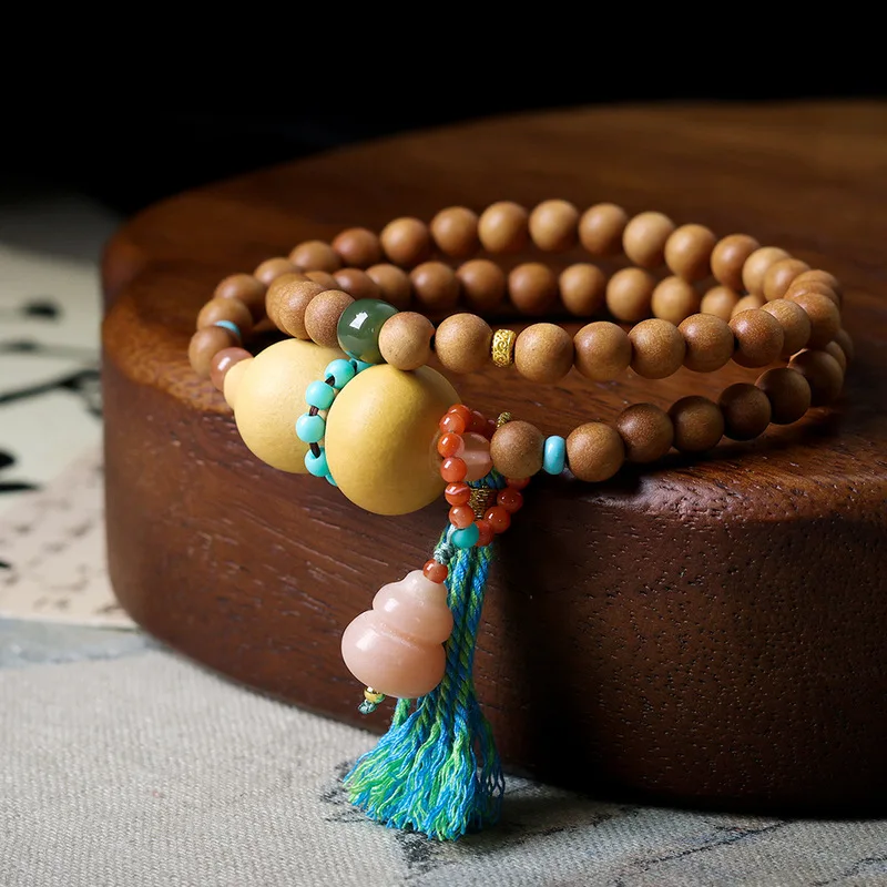 Original Barbie sandalwood bracelet with gourd beads featuring multiple layers and a Chinese-style design