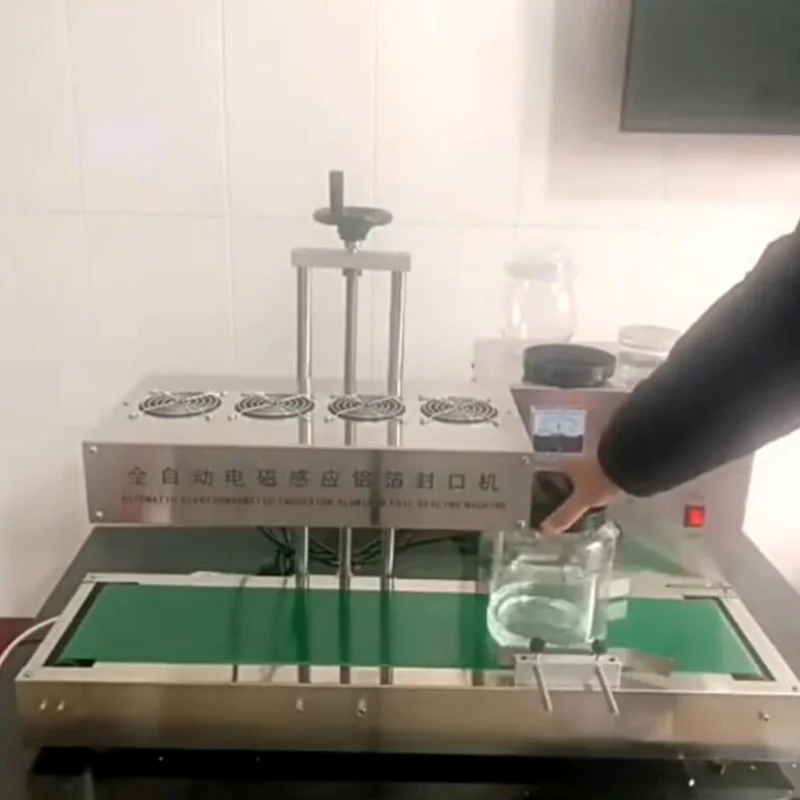 آلة ختم حشية رقائق الألومنيوم ذات الحث الكهرومغناطيسي التجاري آلة الختم المستمر عالية الكفاءة #1