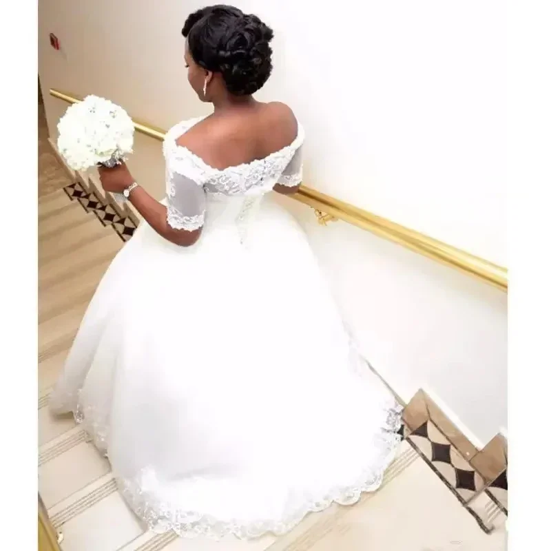 Customized Plus Size African Ball Gown Wedding Dresses Short Sleeves Boat Neck Beaded Crystals Bridal Gowns