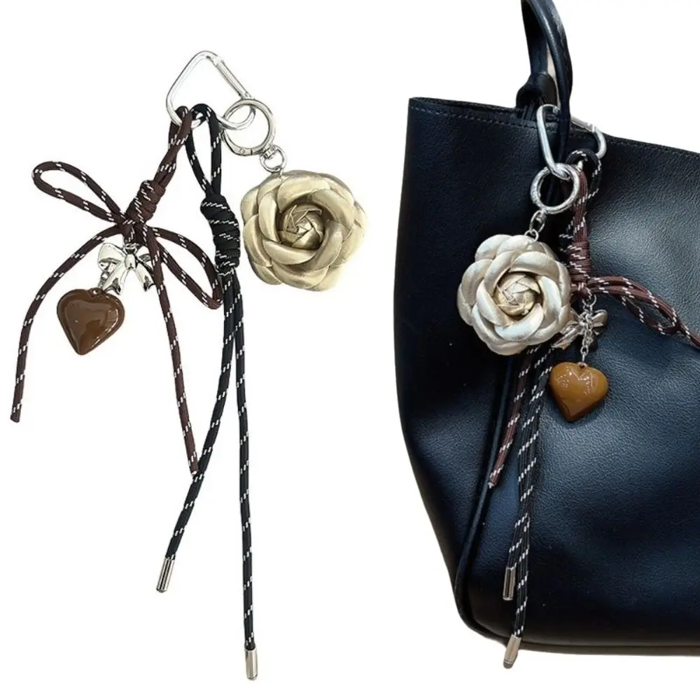 

Брелок с кисточками и цветами камелии, брелок в форме сердца, анти-потерянная подарочная сумка для девочек, подвеска ручной работы, плетеная веревка, подвеска в форме сердца, аксессуары для сумки