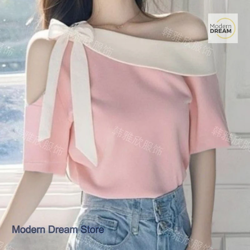 

Joker new temperament high sense T-shirt female French fashion design sense oblique collar off-the-shoulder bottoming cover top.