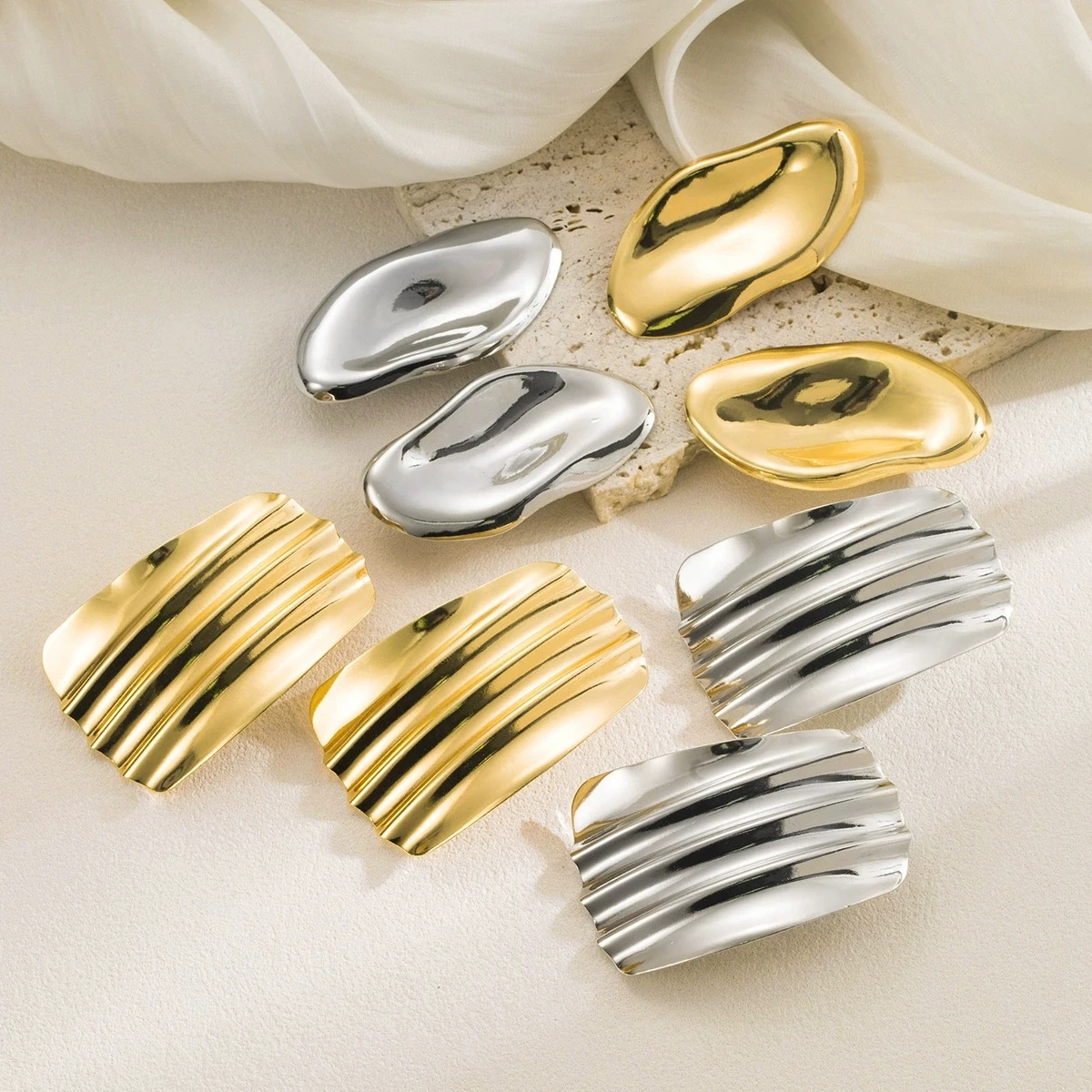 Exaggerated geometric irregular metal earrings, fashionable glossy pleated concave-convex design ear accessories