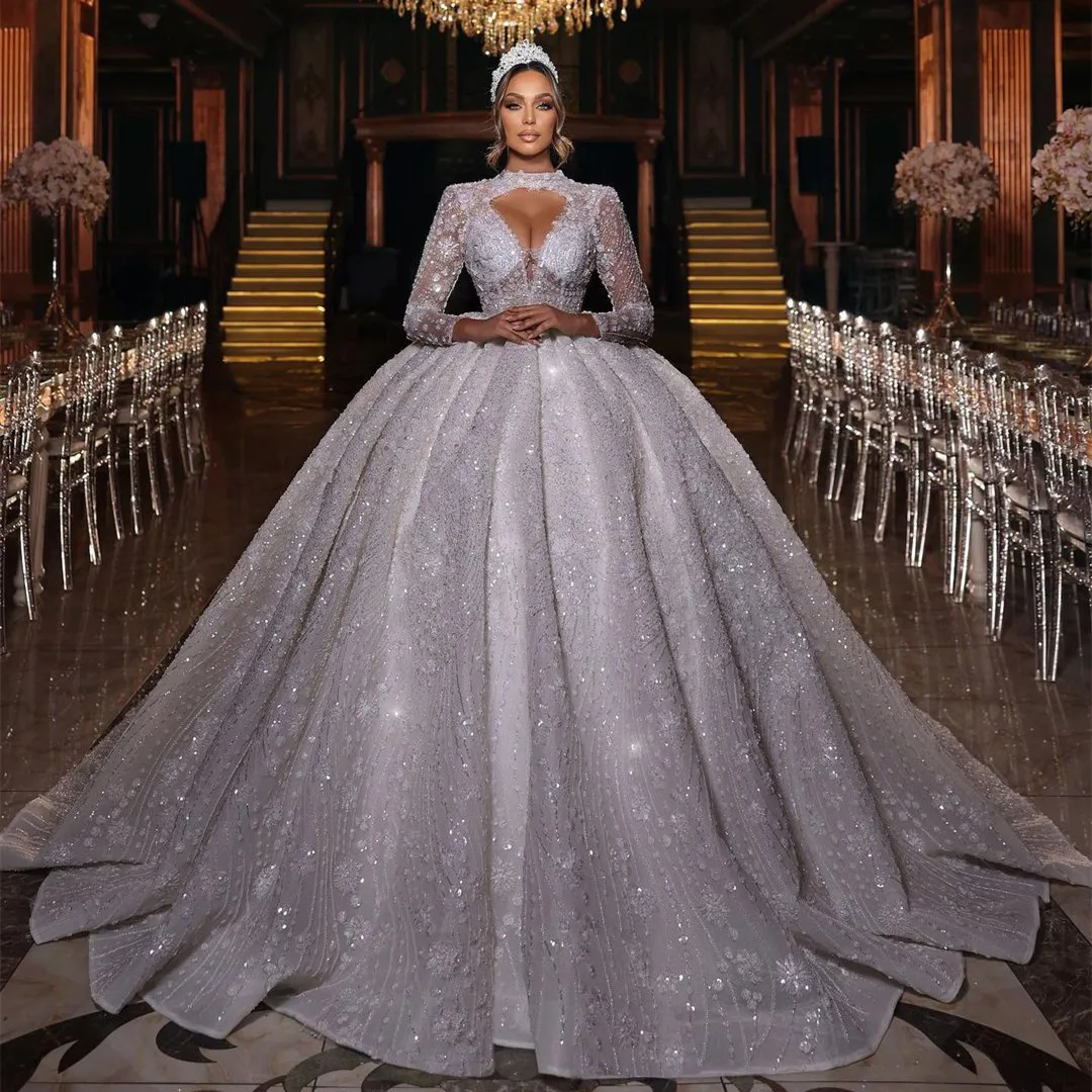 

Роскошное бальное платье Свадебное платье с длинными рукавами и V-образным вырезом Холтер с блестками Аппликации из бисера Кружевные свадебные платья Vestina De Novia по индивидуальному заказу