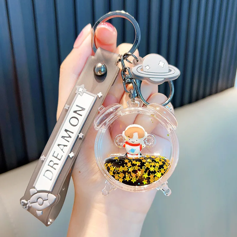 Fun and Cute Astronaut Alarm Clock with Black Liquid Sand Embellished with Gold Color Star Shaped Sequins Key Chain Man KeyChain
