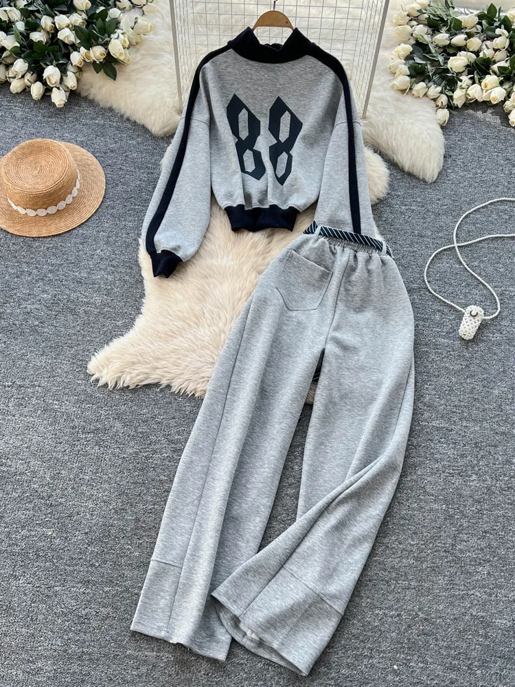 ชุดเซ็ตเสื้อฮู้ดแขนยาวสไตล์เรโทรอเมริกันสีตัดกัน กางเกงขายาวเอวสูงทรงขากว้างสำหรับผู้หญิง ชุดลำลองแฟชั่น